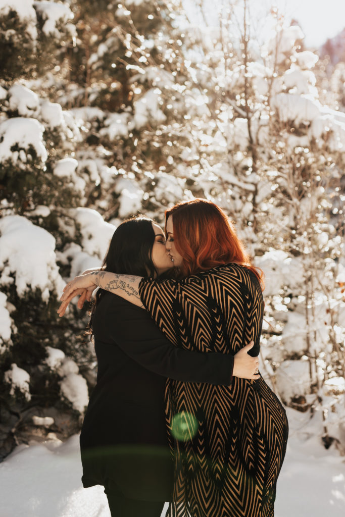 lgbtq+ couple in park city kissing
