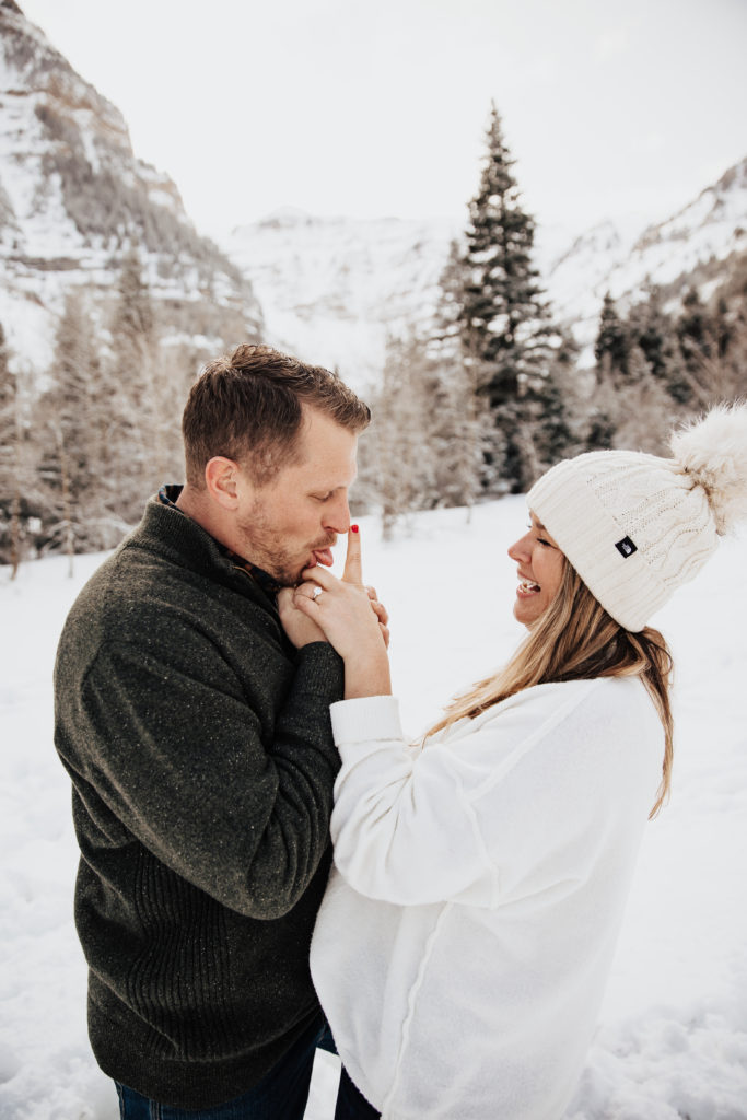 candid engagement photos in the snow
