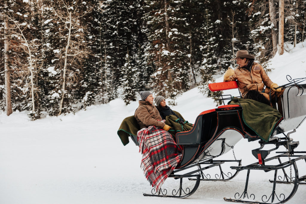 couple goes for a sleigh ride in the winter