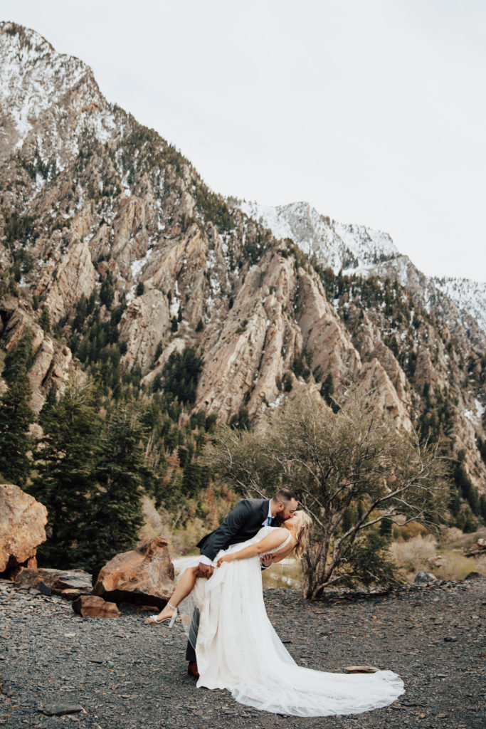 elopement in big cottonwood canyon couple dip kissing
