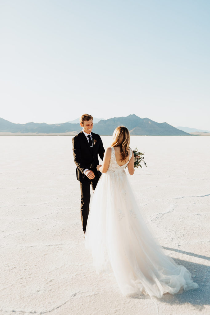 first look at salt lake city utah salt flats couple getting married