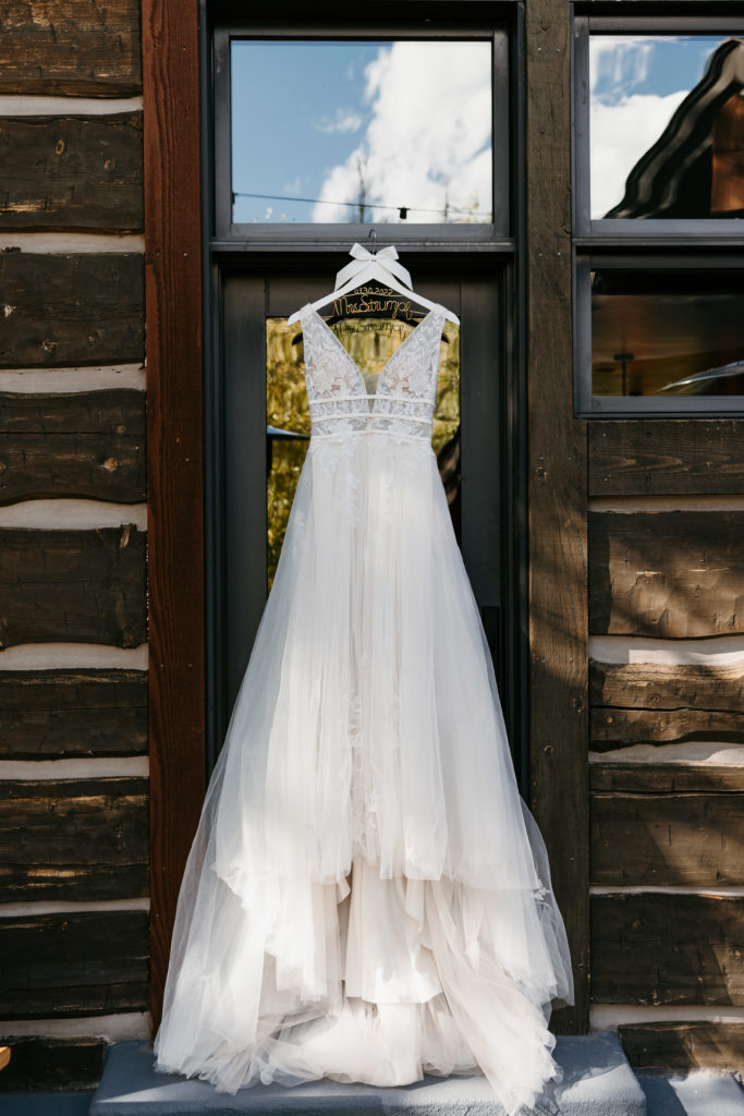 hanging wedding dress in cabin